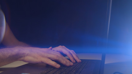 Playing video games close up with a black background