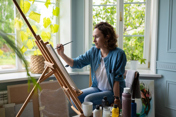 Artist creating artwork in home studio