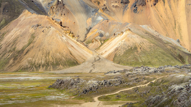 Green volcanic hills and trails in Icelandic highlands