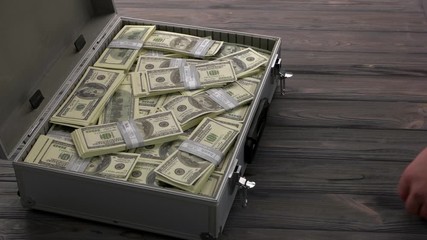 Process of taking and giving a bribe. Man giving suitcase with dollars and giving bag full of toilet papers. Coronavirus Covid-19 pandemic.