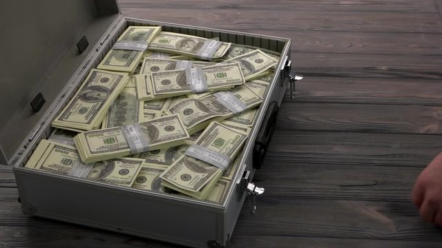 Process of taking and giving a bribe. Man giving suitcase with dollars and giving bag full of toilet papers. Coronavirus Covid-19 pandemic.