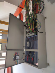 SELANGOR, MALAYSIA -AUGUST 19, 2020: Electrical distribution board in the installation process. Electrical wireman will install this equipment according to the electrical engineer design.