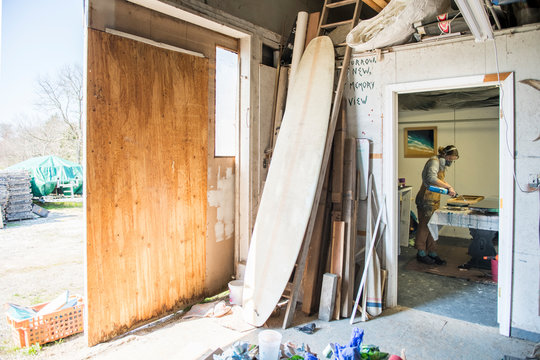 Female resin working in homemade studio - Powered by Adobe