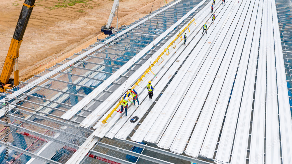 Wall mural steel roof structure at construction site