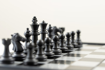 Black chess pieces on the board for business strategy planning concept