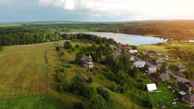 Russian aerial panoramas of the village with a Christian church.
