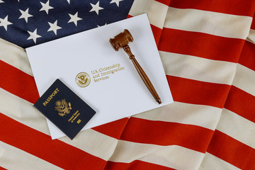 US Passports with wooden judge gavel on American flag on legal world immigration concepts a...