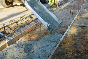 Construction process making of freshly poured cement sidewalk