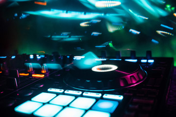 Fototapeta na wymiar DJ mixer controller for mixing music in a nightclub