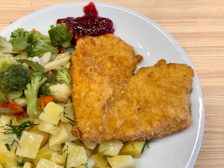 Heart Shaped Schnitzel with Marmalade Jam Sauce and Broccoli Vegetables Served with Tray at Restaurant.