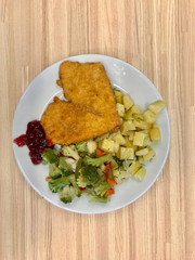 Heart Shaped Schnitzel with Marmalade Jam Sauce and Broccoli Vegetables Served with Tray at Restaurant.