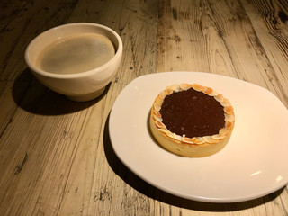 Espresso Tart Served with Coffee on Wooden Table at Cafe Shop
