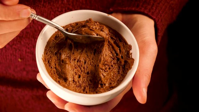 Woman Eating Delicious Chocolate Mousse