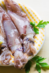 fresh squid with lemon on the plate