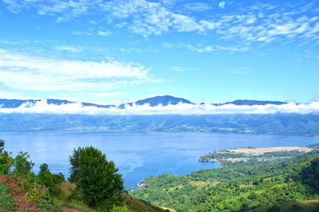 Fototapeta na wymiar Beautiful scenery of hills and lakes with blue sky on a sunny day from Aua Sarumpun peak