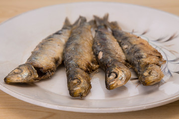 roasted sardines on the plate