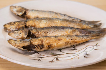 roasted sardines on the plate