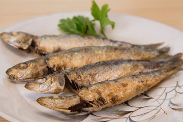 roasted sardines on the plate
