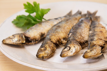 roasted sardines on the plate