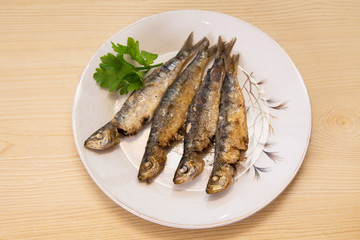 roasted sardines on the plate