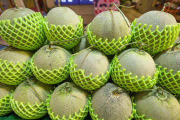 Lots of Melon at bazaar. agriculture farm full of organic vegetables. Pile of honey melon in the store. (selective focus)