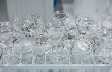 Empty clear glass medicine bottles. Medical manufacturing background