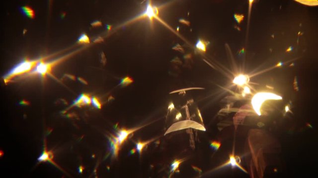 Easy to add lens flare effects for overlay designs or screen blending mode to make high-quality video. Abstract sun burst, digital flare, iridescent glare over black background.