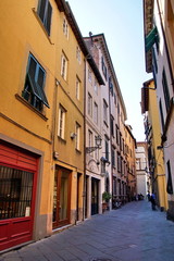 Fototapeta na wymiar Narrow residential street in the historic part of Lucca, Italy