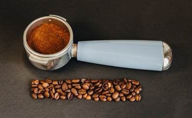 Coffee filter holder with ground coffee beans and coffee beans