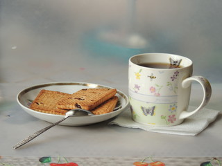 cup of coffee with cookies