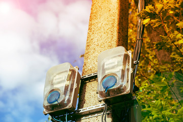 electric meters on a pole, the concept of rising utility rates