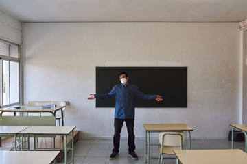 Teacher with mask in a class
