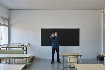 Teacher with mask in a class