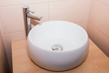 ceramic sink under the faucet. The concept of a healthy lifestyle, hygiene