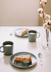 Piece of apple pie on plate with cup of coffee. Breakfast with coffee and cake in cafe. Food photography Table top photo