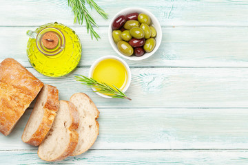 Ripe olives, olive oil and ciabatta bread