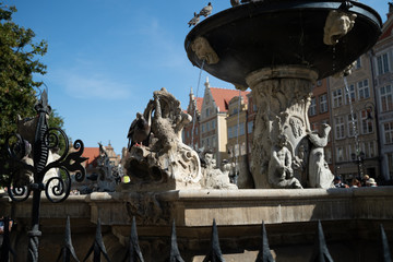 Gdansk, North Poland : Close up rear shot of a most touristic attraction neptune's fountain located...