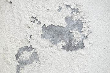 Old peeling plaster white wall texture.