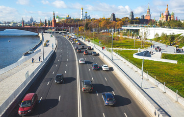 October 22, 2017 Moscow, Russia. Cars on Moskvoretskaya embankment, Zaryadye Park and a view of the Moscow Kremlin.