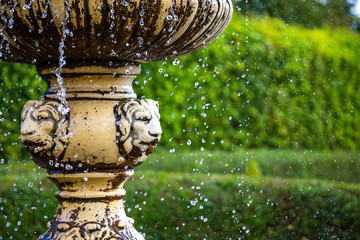Water falling down from the ancient fountain