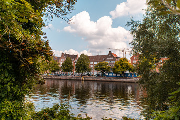Cityscape of Luebeck at the Trave through trees