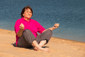 senior lady woman doing yoga exercises outdoors on a bright autumn day