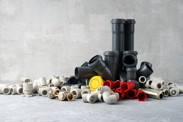 House plumbing pipes and sewerage pipes on the concrete background