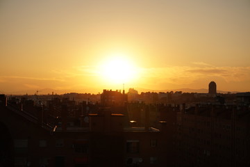 sunset over the city in the park