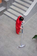 Cleaning in hotel, cleaning lady with a MOP