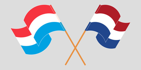 Crossed and waving flags of Luxembourg and the Netherlands