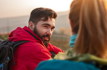 Bearded traveler speaking with girlfriend