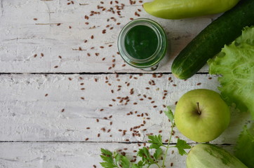 Word detox is made from colored letters. chia seeds. Green smoothies and ingredients. Concept of diet, cleansing the body, healthy eating. lemon green apple, greens, lettuce, vegetables