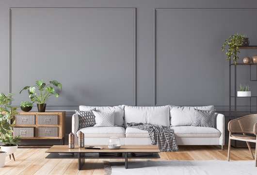 Open space living room interior mockup, white sofa, rattan chair, lots of fresh plants and wooden coffee table, empty dark classic gray wall, panorama, 3d render