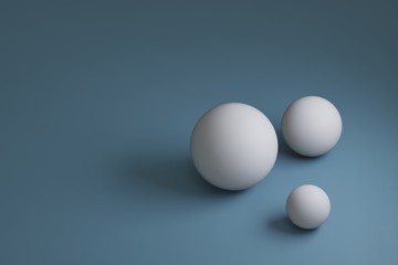 3d render, three white spheres with different sizes on blue background,